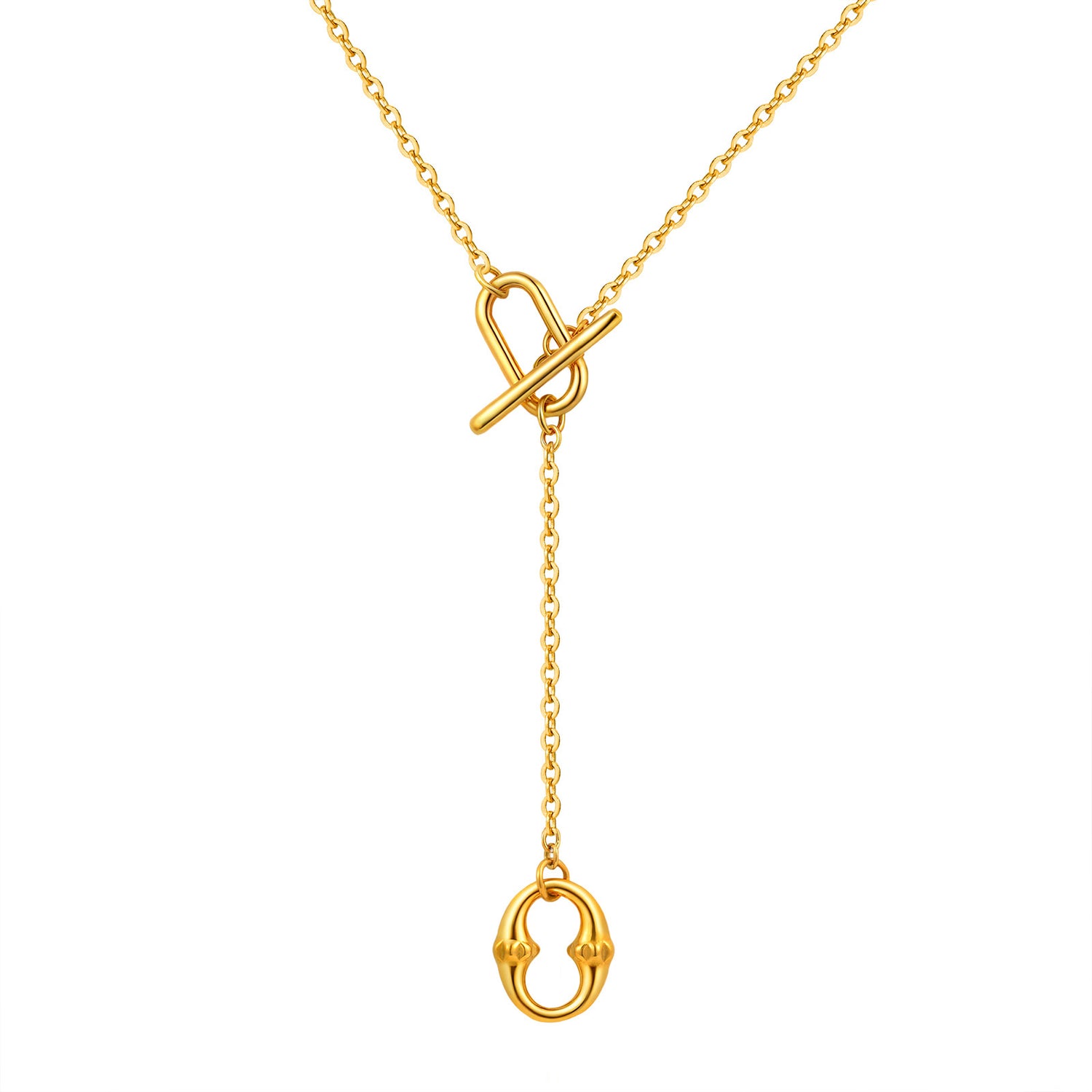Gold tone lariat necklace held in hand to show the toggle and pendant scale