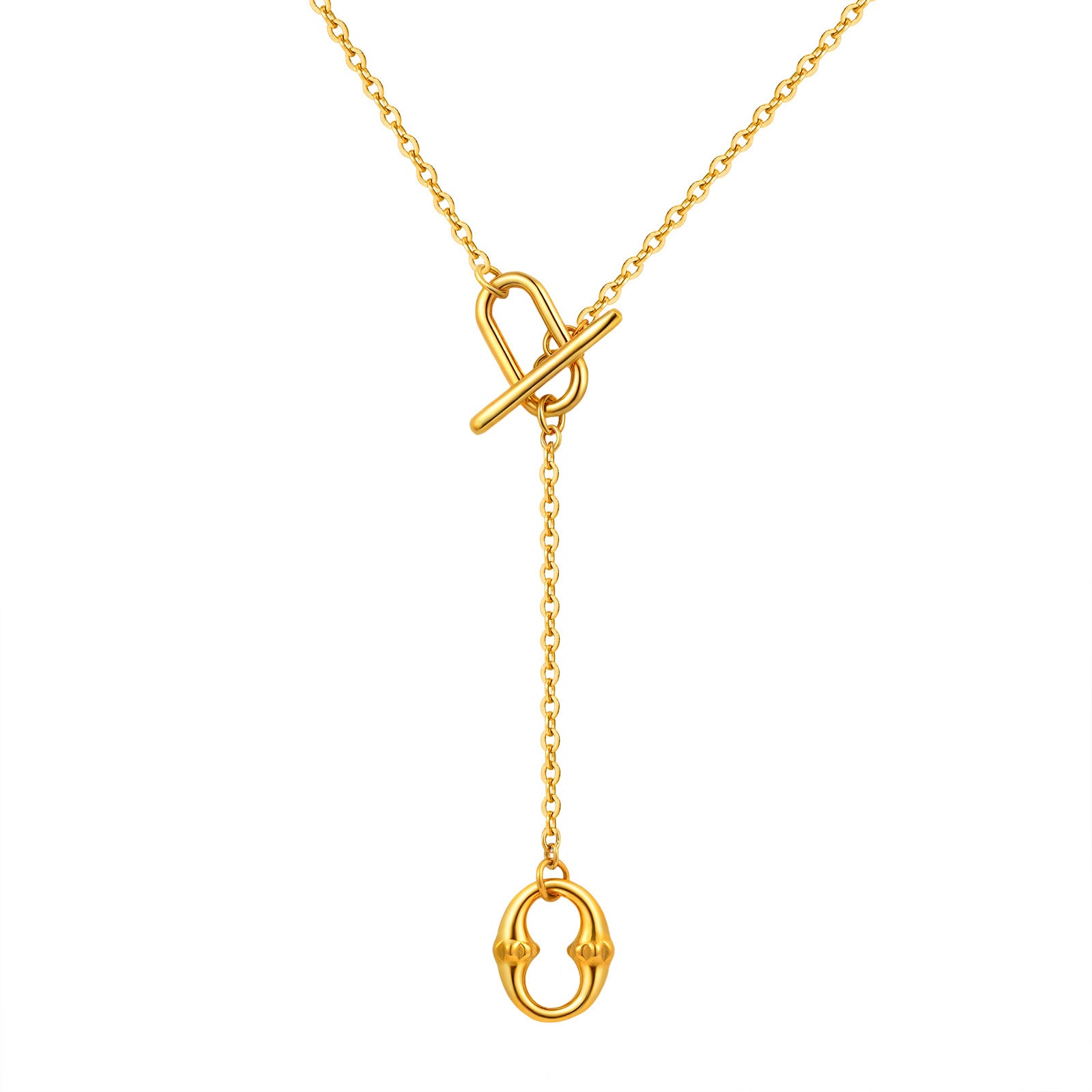 Gold tone lariat necklace held in hand to show the toggle and pendant scale