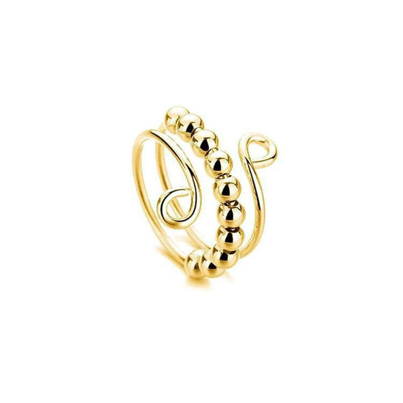 Gold tone double band spinner ring, beads threaded on one loop, open coil ends for an adjustable fit