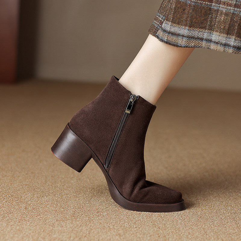 Brown suede finish ankle boot with chunky block heel and inside zipper worn with a plaid skirt