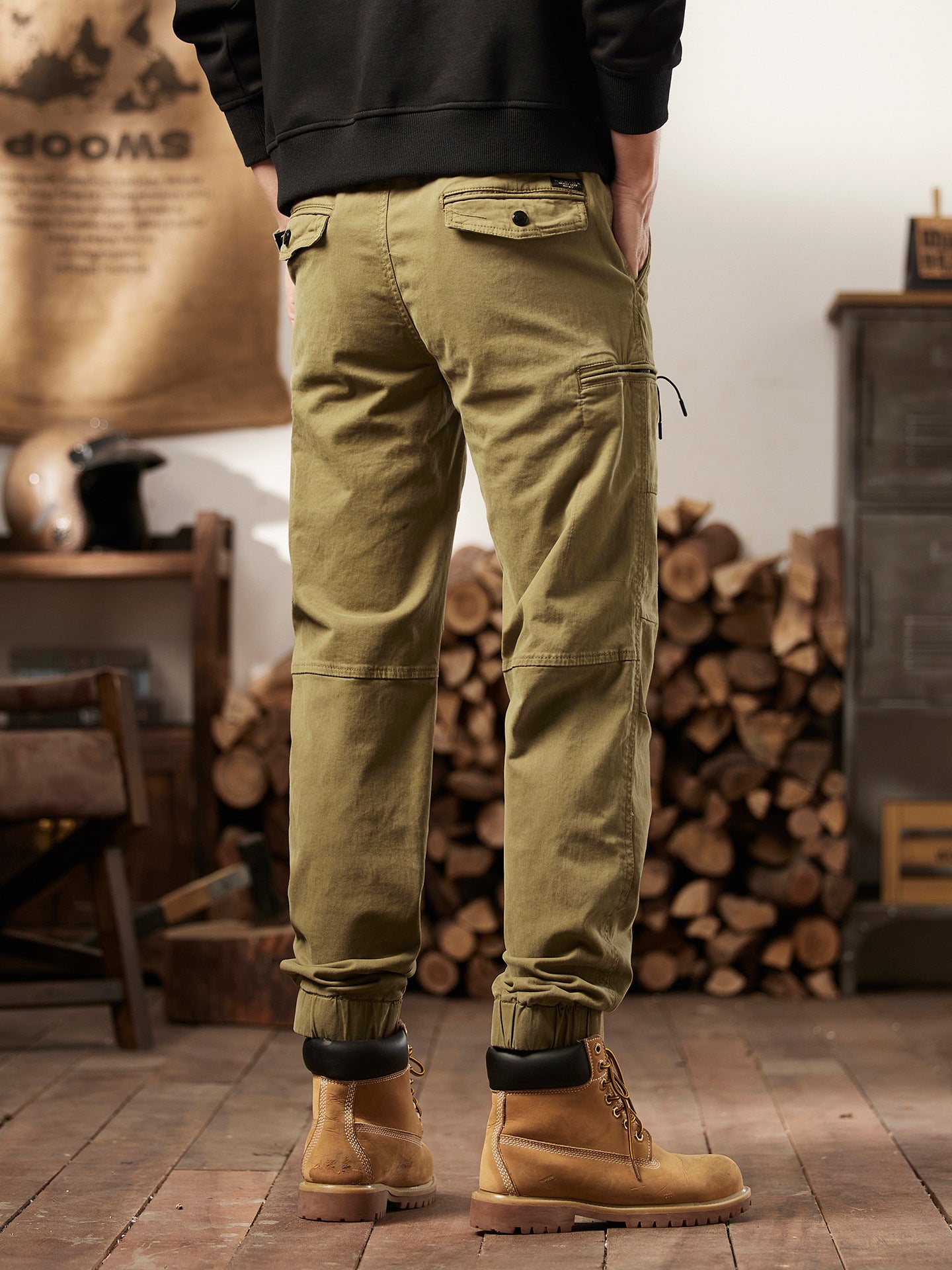 Hand resting in the thigh cargo pocket showing pocket depth and scale