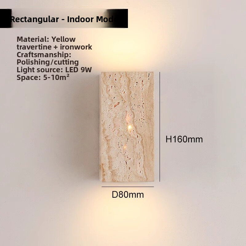 Travertine wall lamp on a hallway wall giving a gentle two direction glow