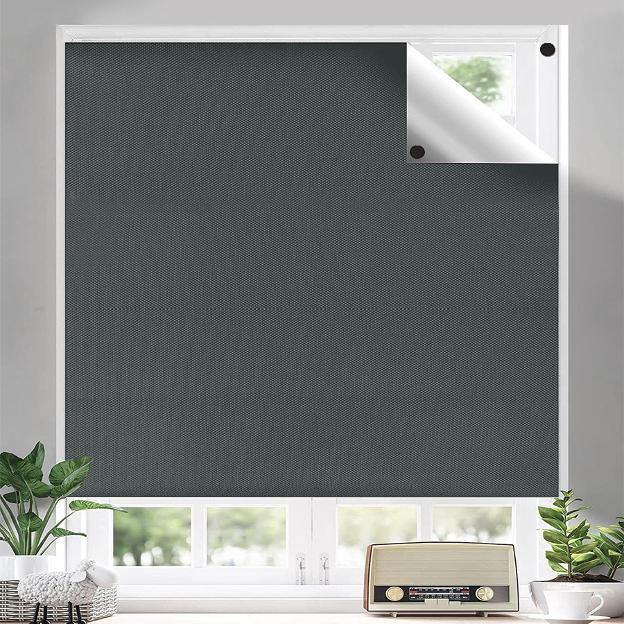 Blackout curtain panel styled across a sunlit window frame