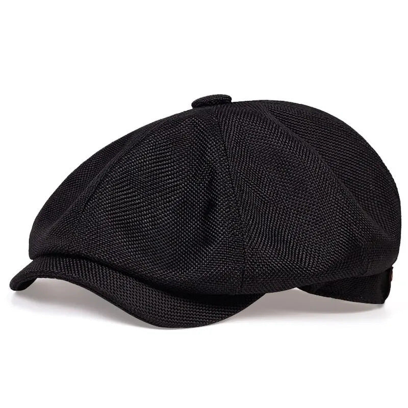 Close view of the slubby linen look weave and covered top button on the newsboy cap