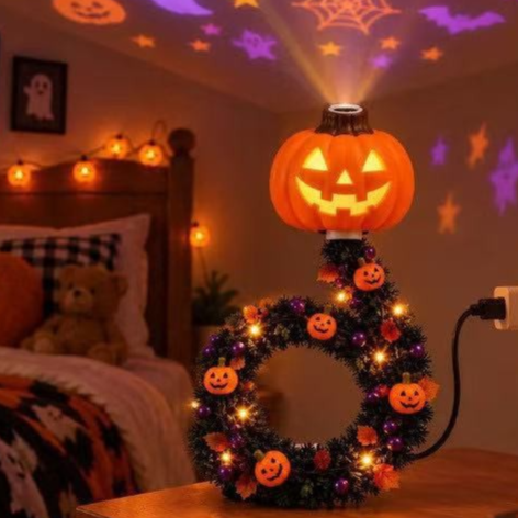 Halloween pumpkin USB projector light with a wreath ring of small pumpkins projecting purple stars and bats in a bedroom
