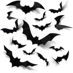 Cluster of black 3D bat wall stickers with folded wings arranged on a white wall