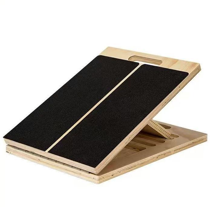 Wooden stretching board tilted on its hinged support above a grooved base, black non-slip panel, Stretching board option