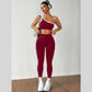 Front view of the two tone color blocked yoga set, one shoulder crop bra and matching leggings