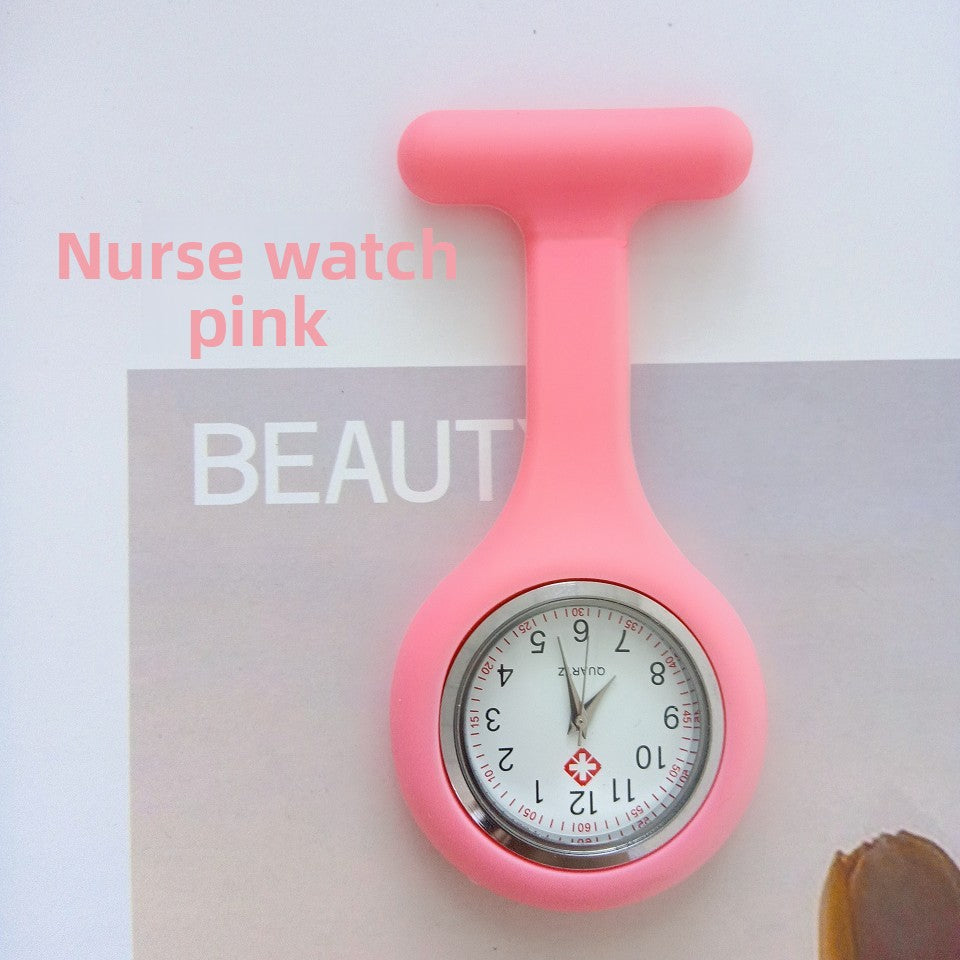 Rose red silicone nurse fob watch with a small round analog dial, angled view