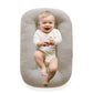 Close up of the soft cotton cover and padded bolster rim on the baby lounger nest