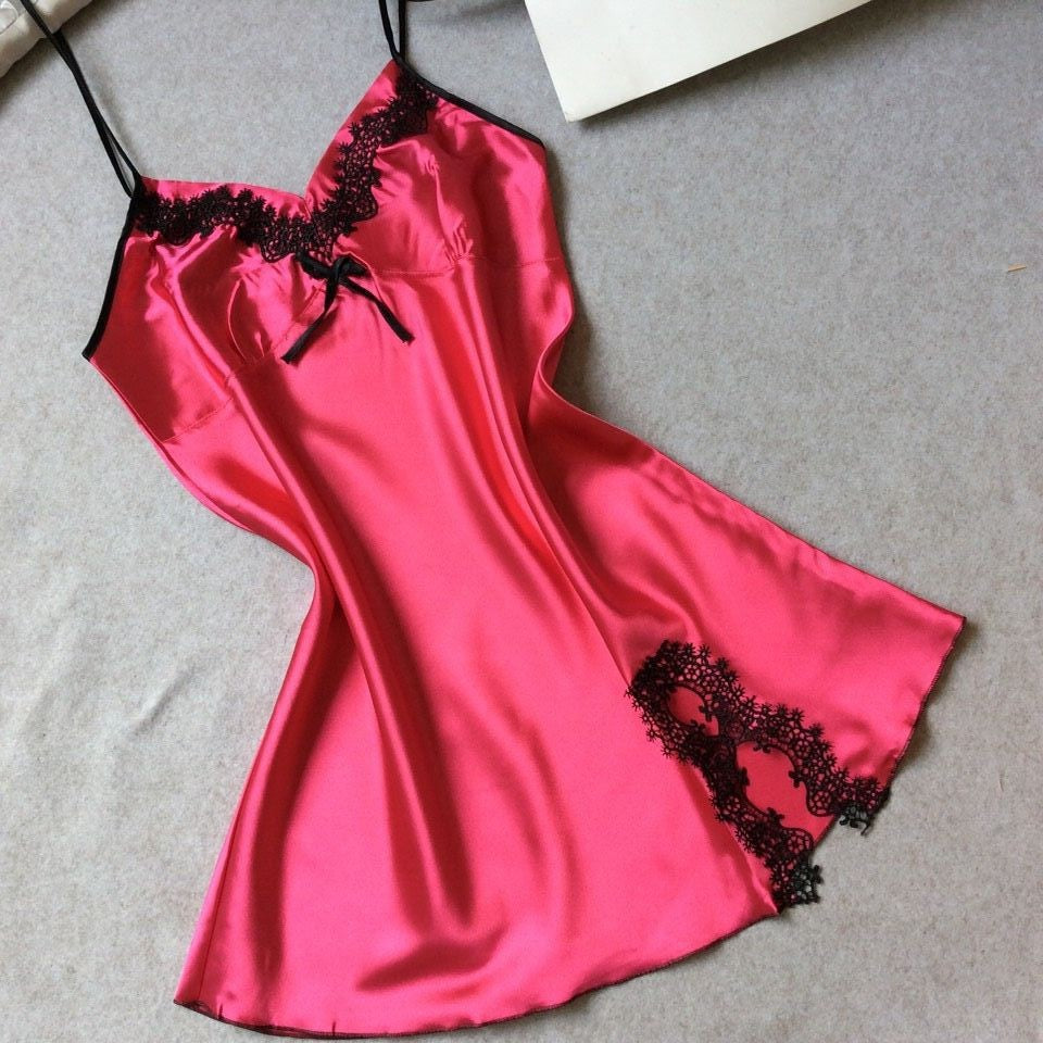 Rose red satin slip nightdress with black lace at the neckline and hem, flat on a gray cloth, option photo for size XXL