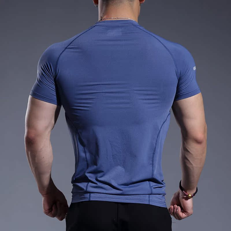 Men's quick-dry fitness t-shirt styled with shorts for the gym