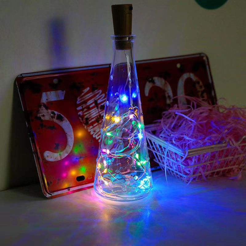 Warm white cork LED bottle string light set on a table as soft evening ambiance lighting