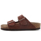 top view of a army green cork sandal with two adjustable pin buckles