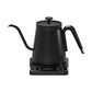 Black gooseneck electric kettle seen from the front on white, glass lid and lit base panel visible