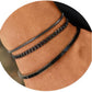 Silver layered bracelet set of three stacked on a wrist