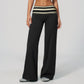 Model in wide leg pants with a fold over printed waistband, black with cream stripes