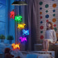 Puppy LED figures glowing in several colors, hanging from a solar lamp head, black housing option