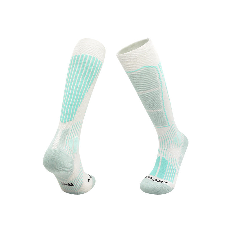 Thick knit ski socks with an arrow pattern up the shin and a padded footbed on white