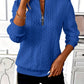 Womens quarter zip pullover shown on a model with jeans, mock neck short zip