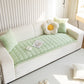 Sweet Serene Green quilted plush sofa cover on a sofa, 90 x 210 cm