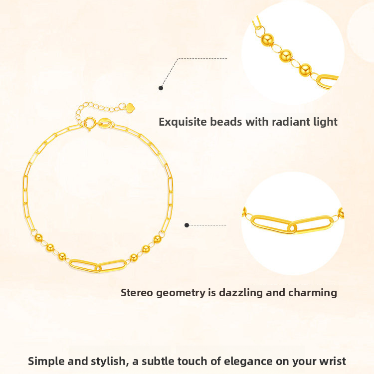 Side profile of the gold bead bracelet showing the fine band and clasp
