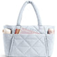 Range of the quilted padded shoulder bag shown in several soft colors