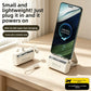 White capsule power banks with a stand and detachable cable, one charging a phone upright on a desk