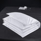 Soft white down bed pillow shown full and lofted against a plain background