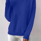 Woman wearing a royal blue half-high neck pullover sweater with long sleeves and a ribbed hem