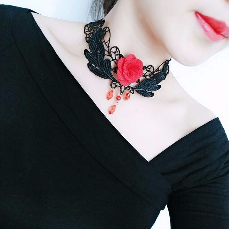 Lace choker necklace with an alloy filigree centre and small dangling beads