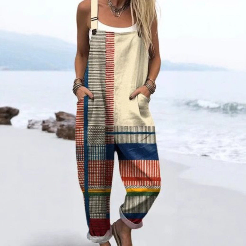 Loose overall jumpsuit worn over a tee, button straps and rolled cuffs