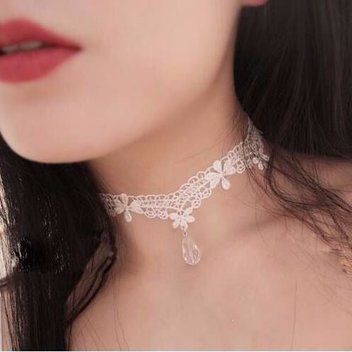 Vintage lace choker necklace with a faceted cabochon centre and hanging bead drops