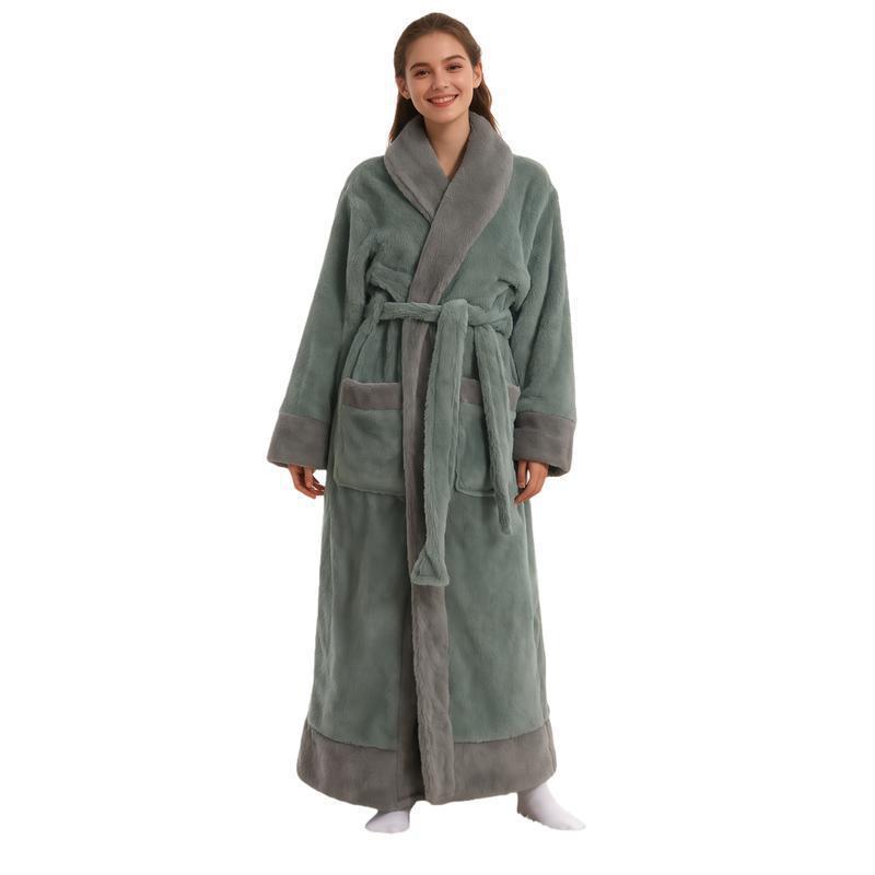 Woman wearing a long sage green flannel bathrobe with gray shawl collar, cuffs, pockets and hem, sage green variant
