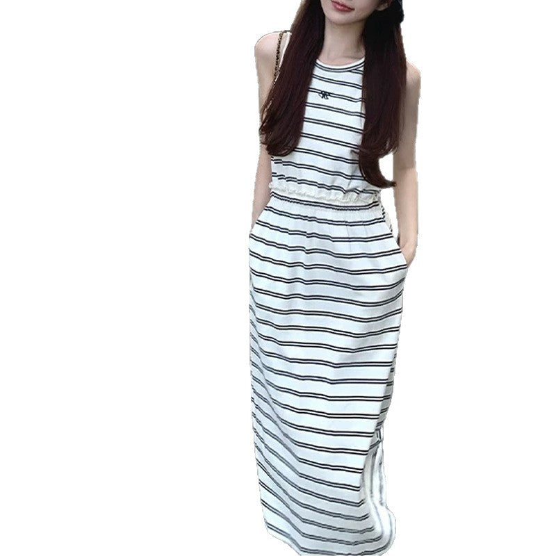 Striped sleeveless maxi dress with hidden side pockets shown on a white background