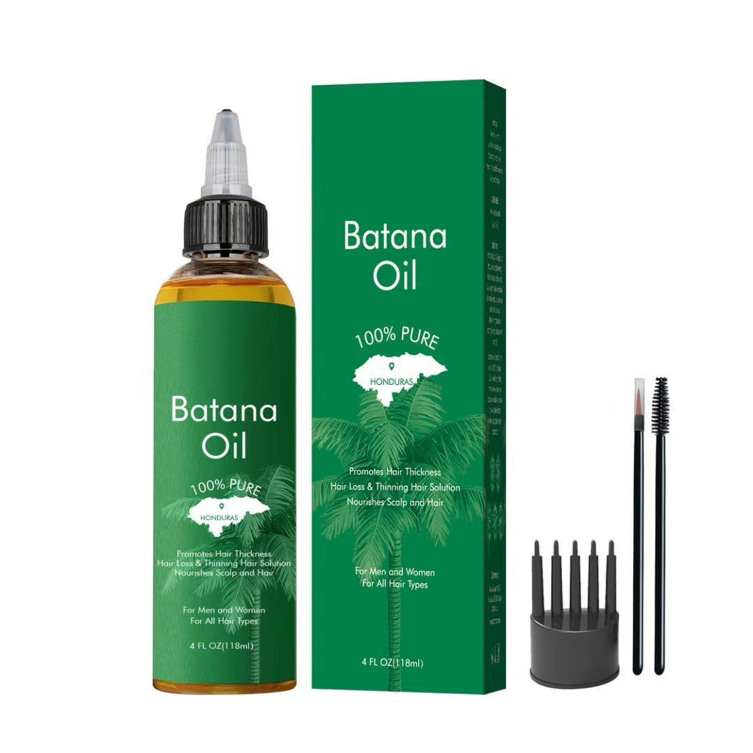 Green batana seed hair and scalp oil bottle and box with a palm motif, scalp comb and spoolie brushes