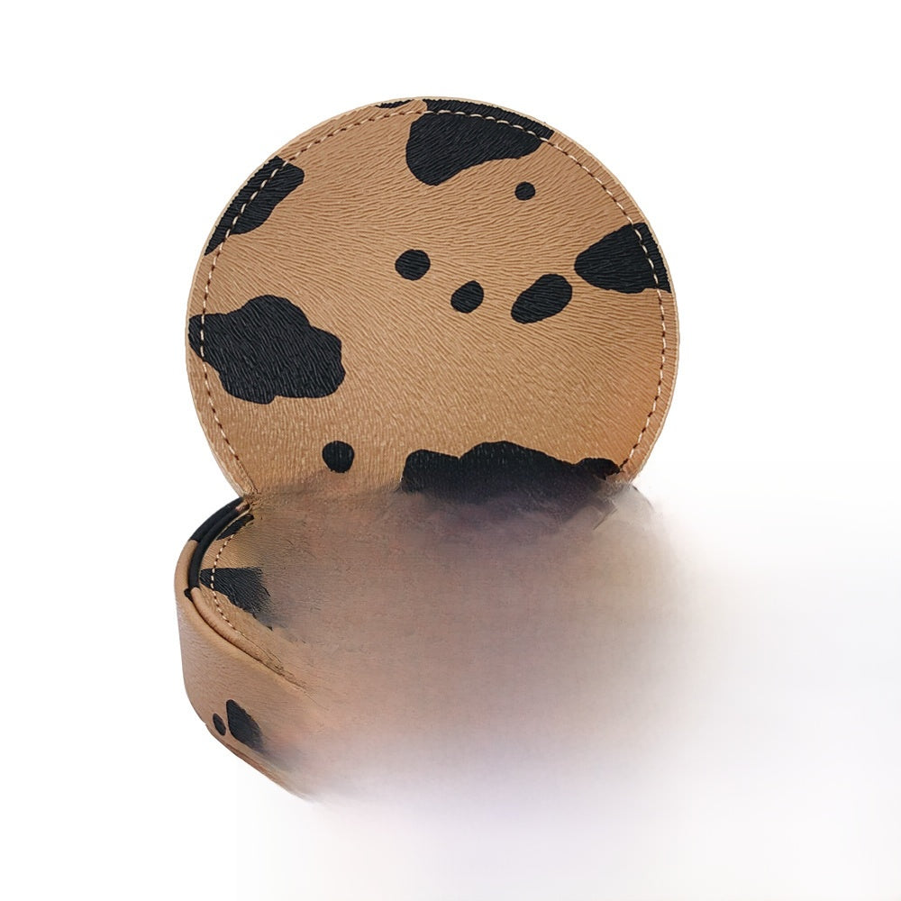 Tan animal print PU leather round coaster with a matching holder