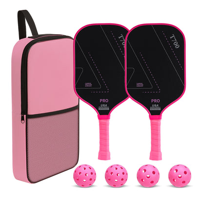 Pickleball set laid out with two black carbon faced paddles, four pink balls and a pink zip carry bag
