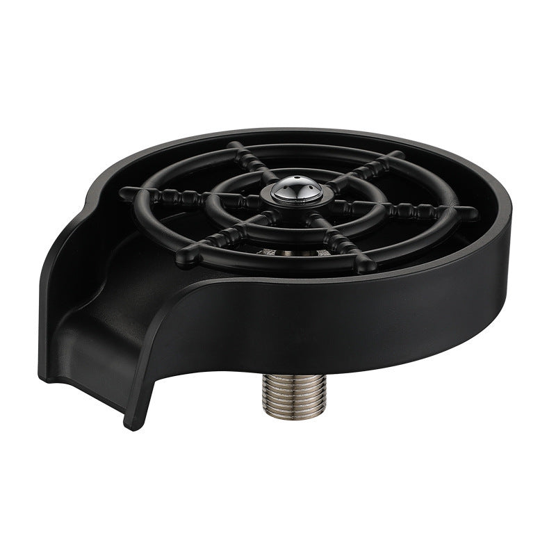 Black high pressure glass rinser standing beside a kitchen faucet on a stainless sink