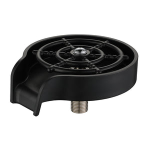 Black high pressure glass rinser standing beside a kitchen faucet on a stainless sink