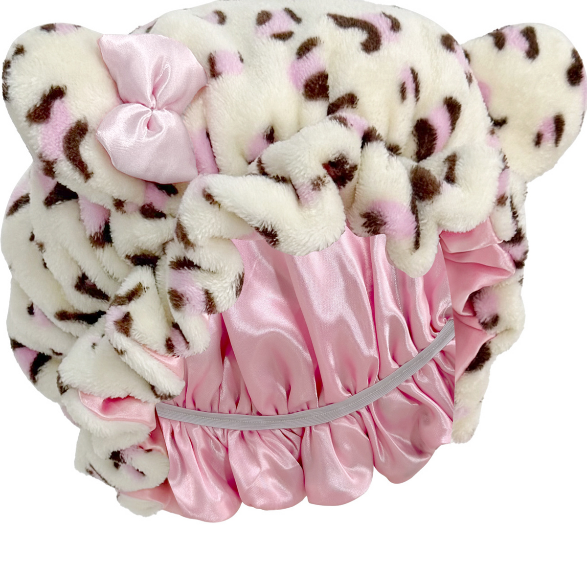 Close view of the leopard print bear ear sleep cap showing the pink satin lining and the elastic band