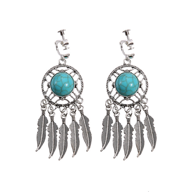 Bohemian tassel and bead clip-on drop earrings, aged tone zinc alloy frame, handmade pair on plain white background