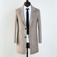 Close reference shot of the herringbone weave and notch lapel edge detail