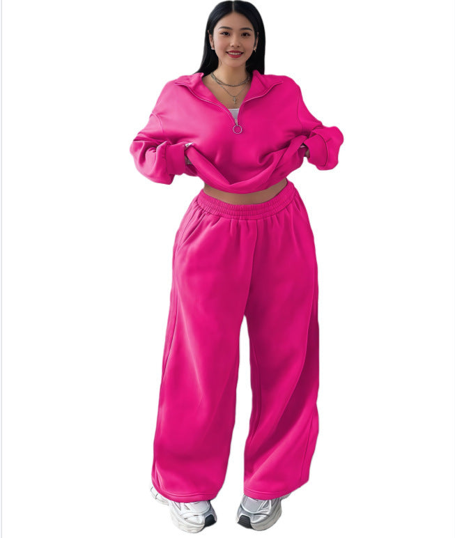 Hot pink cropped half-zip sweatshirt and wide-leg sweatpants set on a model, size L option