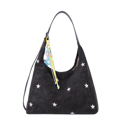Single-shoulder bucket bag shown at an everyday carry angle with strap