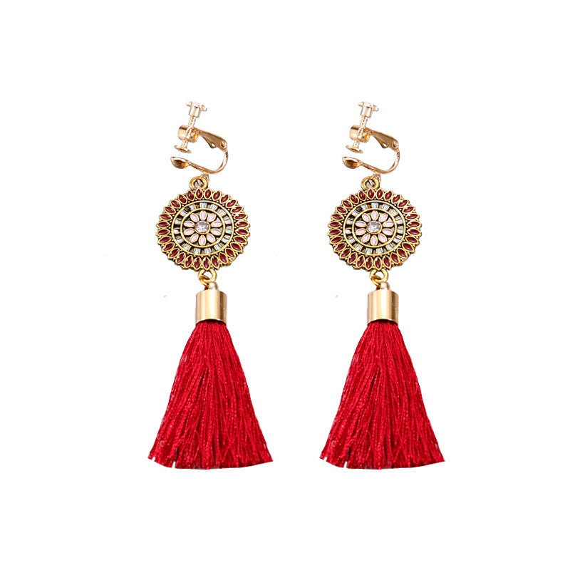 Vintage boho tassel clip-on earrings for non pierced ears, zinc alloy drop pair photographed on white background