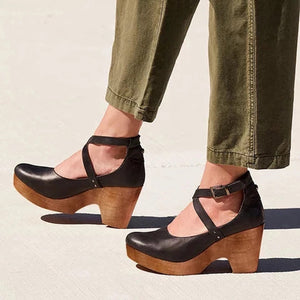 Cross strap chunky heel sandal side profile view