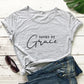 Relaxed round neck cotton t-shirt with a centered Saved by Grace front print
