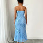 Back view of the strapless dress, mesh covering the back from the band down with a centre seam