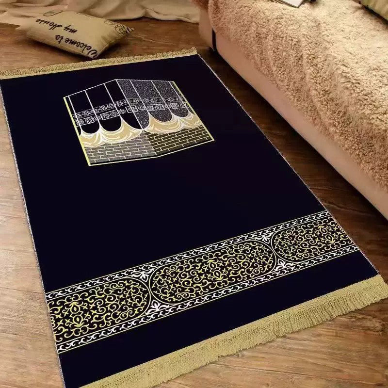 Plush velvet Islamic prayer mat with a printed ornamental design and fringed ends on a wood floor